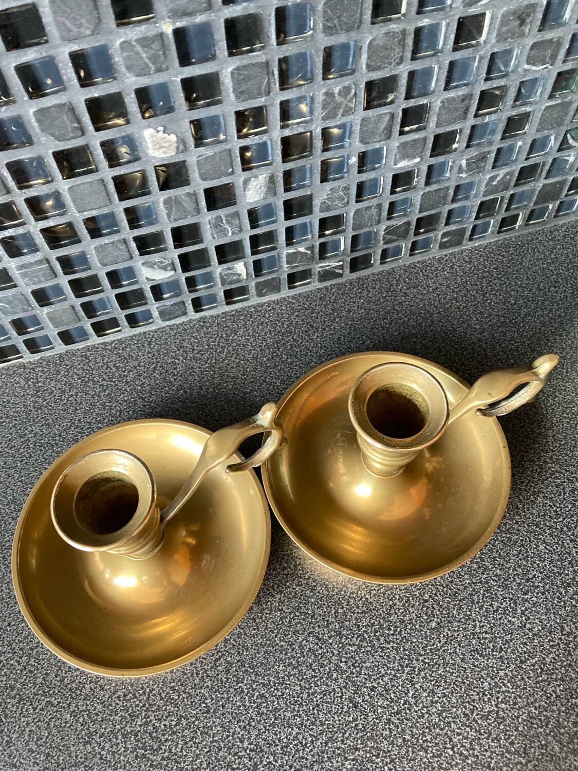 Two brass hand candle holders