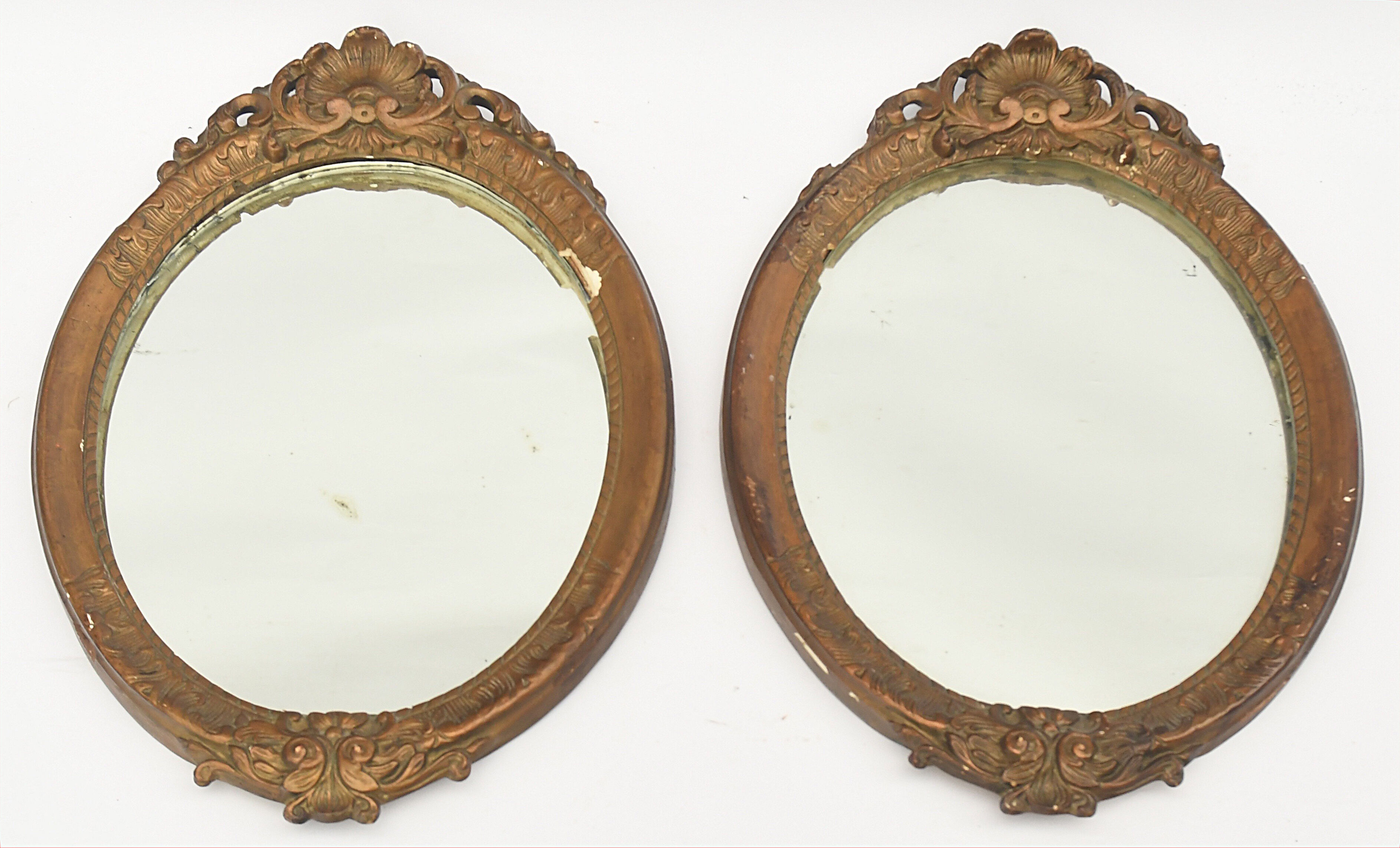 Pair of oval wooden windows with golden patina