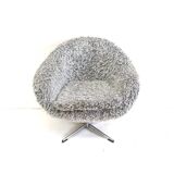 Grey swivel armchair with metal star base made in the 70s