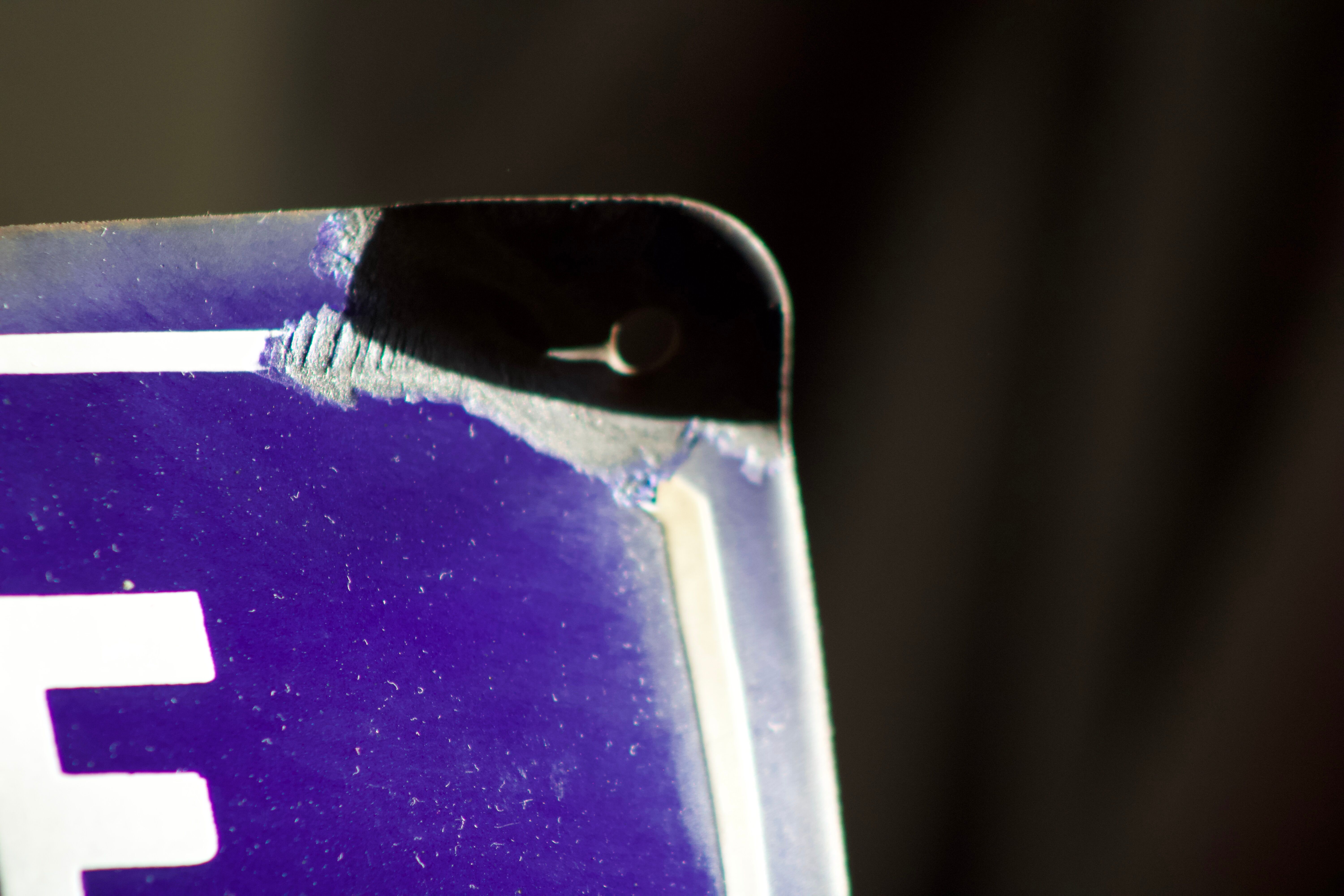 Former French street name plaque in bulging enamel led sheet "Montée des Tupinieres"