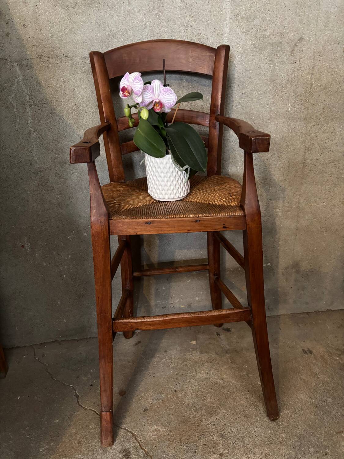 Old straw baby high chair