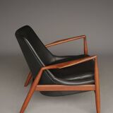 Fauteuil Seal en cuir et teck Ib Kofod-Larsen pour OPE, Suède, années 1960.