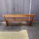 Brutalist bench with dark wood back