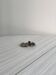 Small silver metal pocket emptier