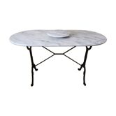 Table bistrot dessus marbre pieds fonte avec plateau tourant