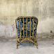 Fauteuil vintage en rotin et tissu à fleurs