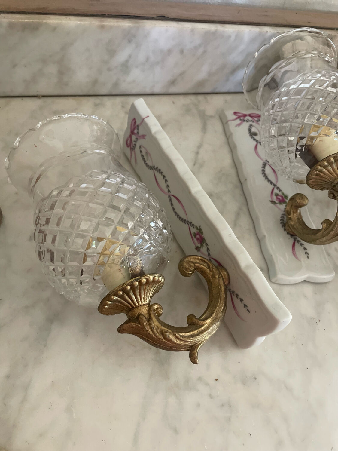 Pair of cut glass and Limoges porcelain wall sconces