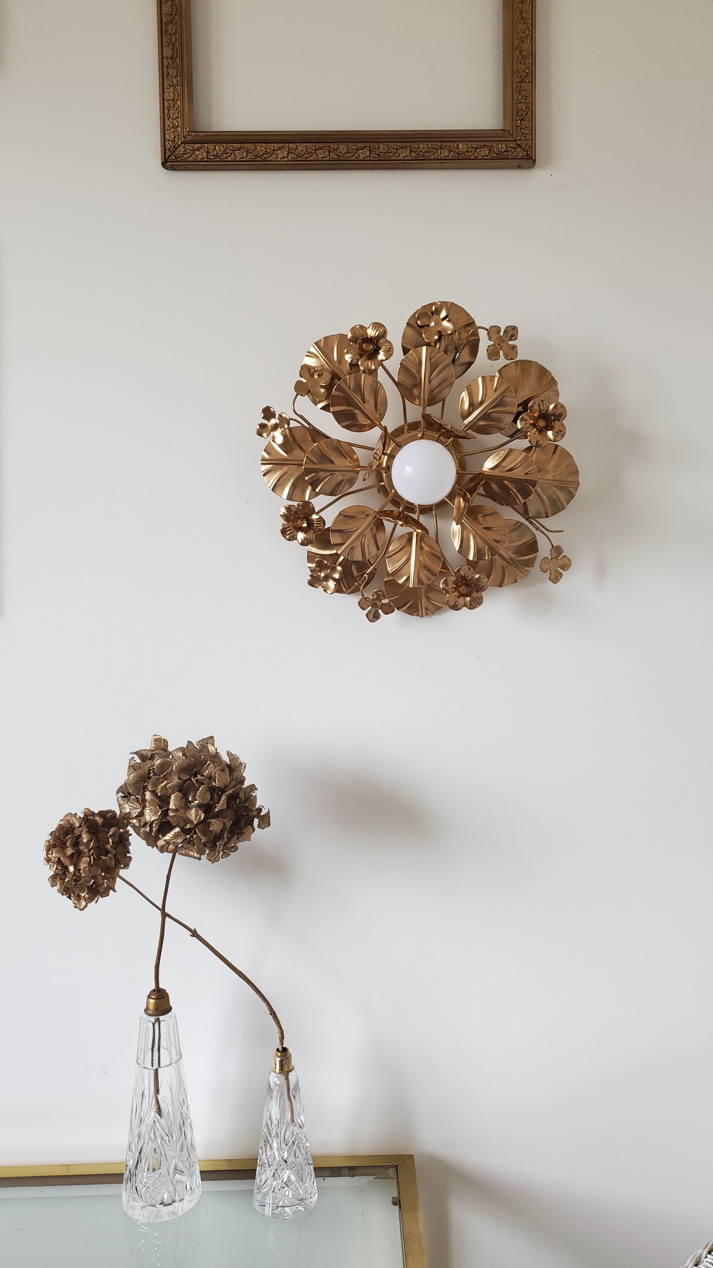 Golden metal flower sconces