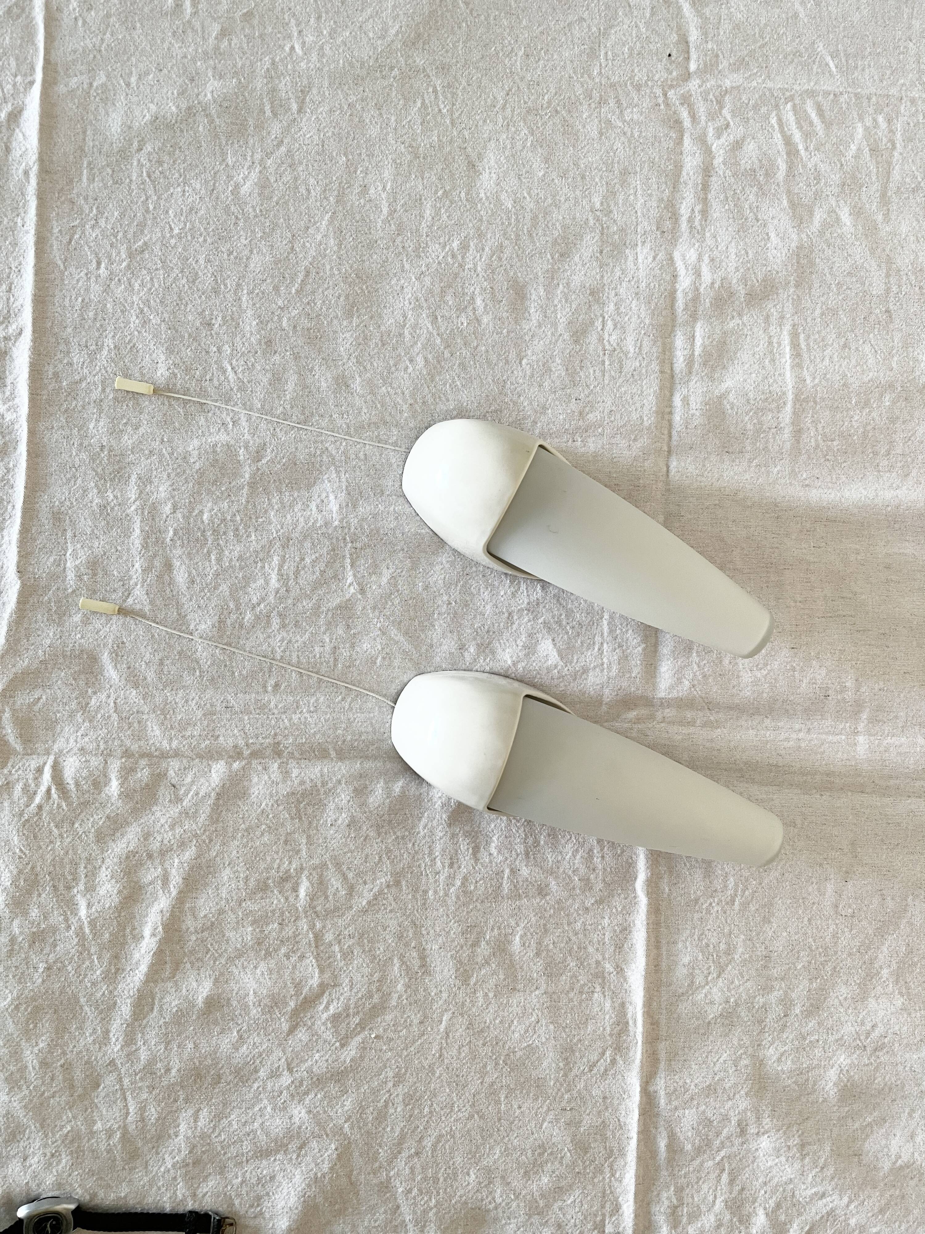 Set of two Small mid-century bakelite & glass wall lamps by Bo Niko Belgium, 1960s