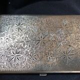 Chiseled bronze cigarette case from the late 19th century