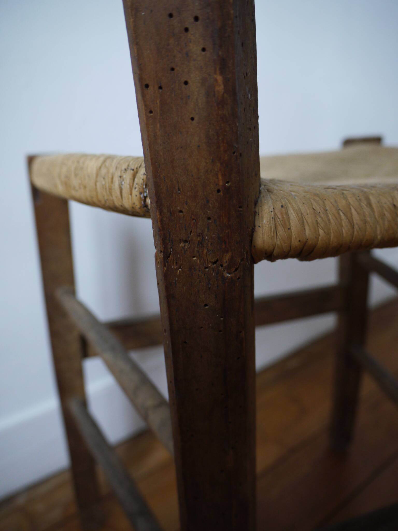 Wooden chair with straw seat