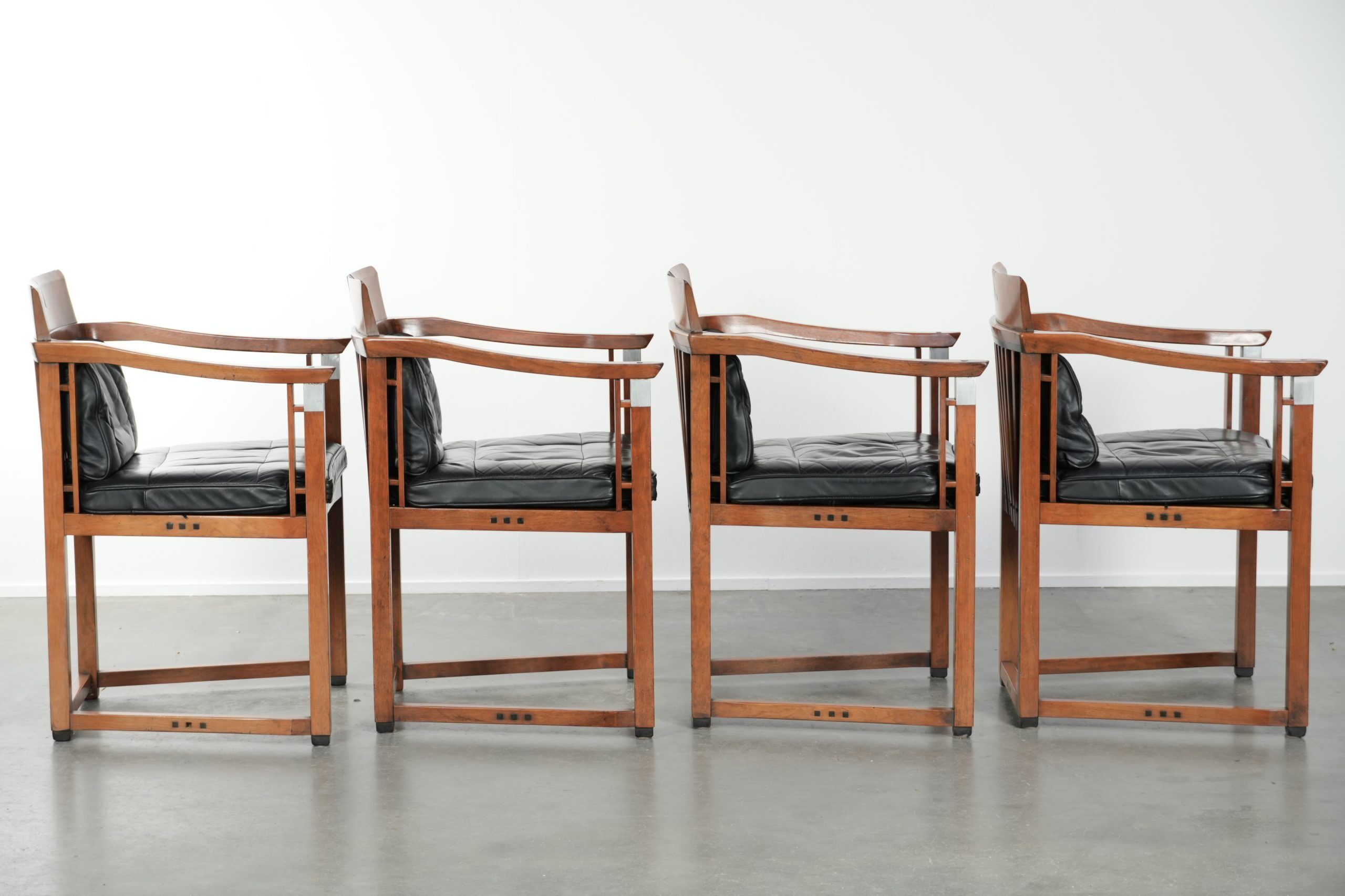 Black leather set of 4 Art Deco design dining chairs with armrests