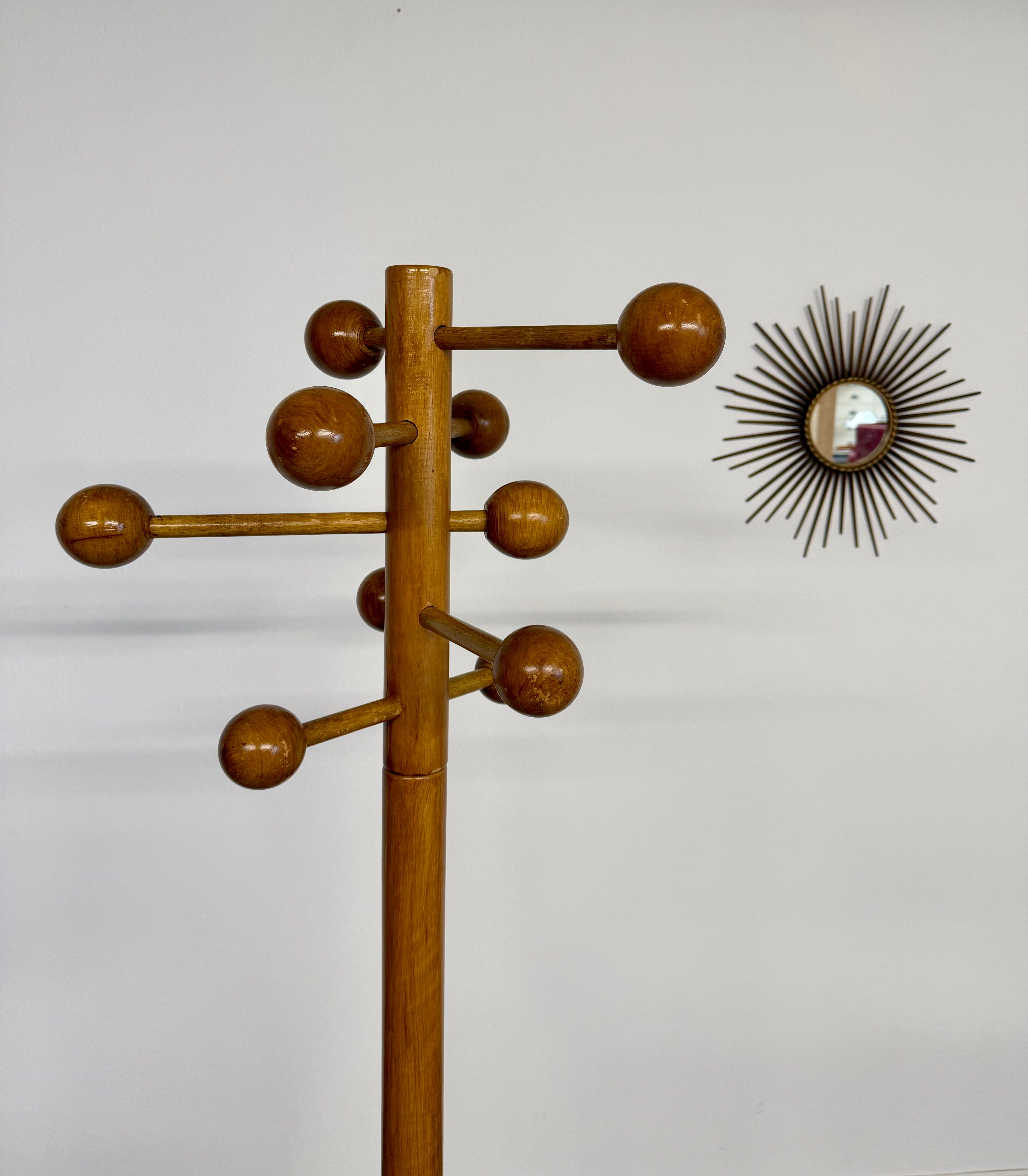 Vintage wooden coat stand with modernist design from the 1970s.