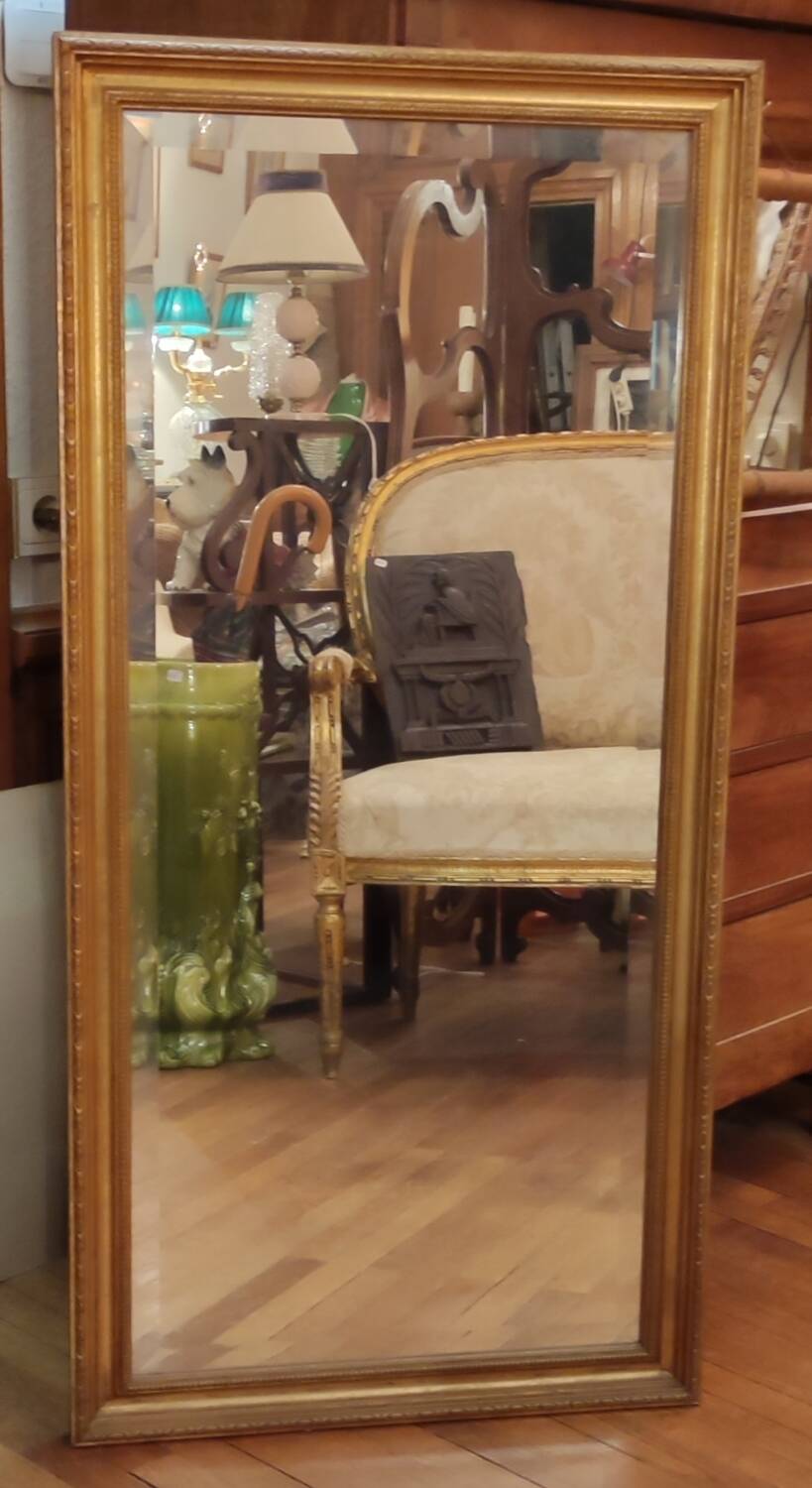 Old beveled mirror with gilded wood frame 20th century