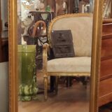 Old beveled mirror with gilded wood frame 20th century