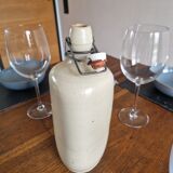Old bottle of beige sandstone hot water bottle