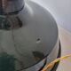 Suspension in enamelled sheet metal and brass
