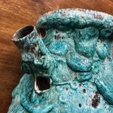 Strange ancient turquoise pitcher