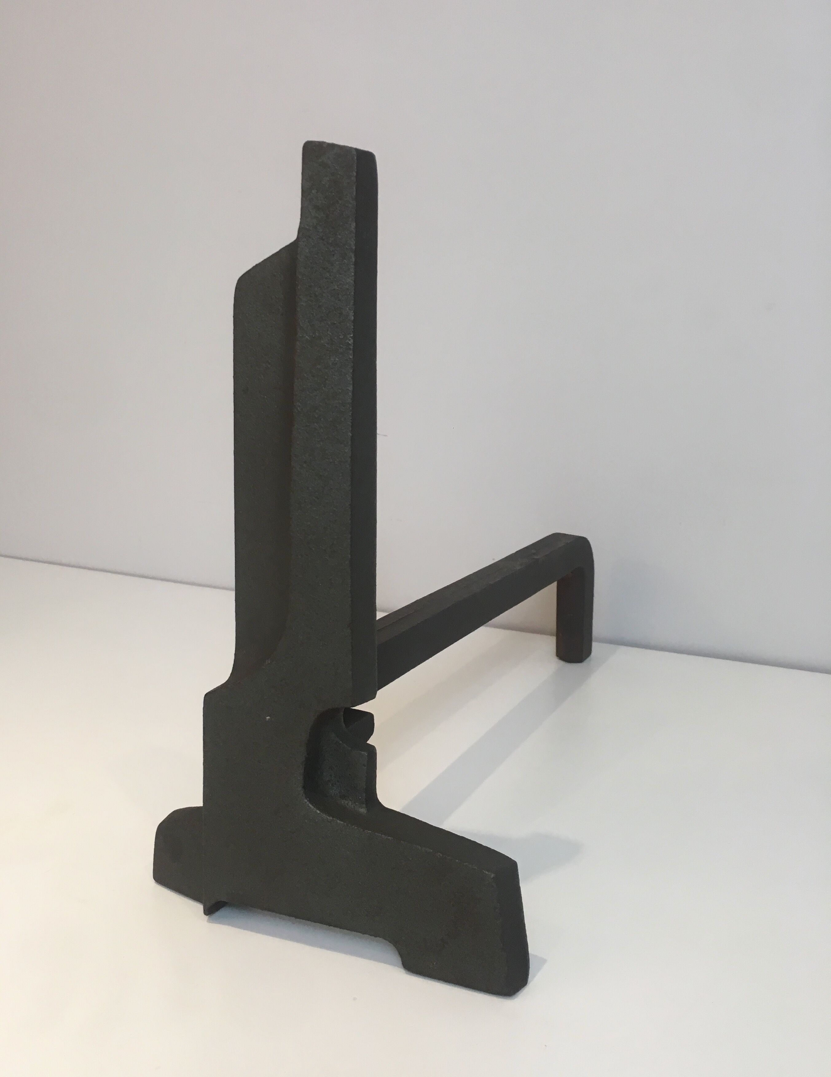 Pair of modernist chenets in cast iron and iron