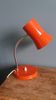 Flexible desk lamp from the 70s in orange.
