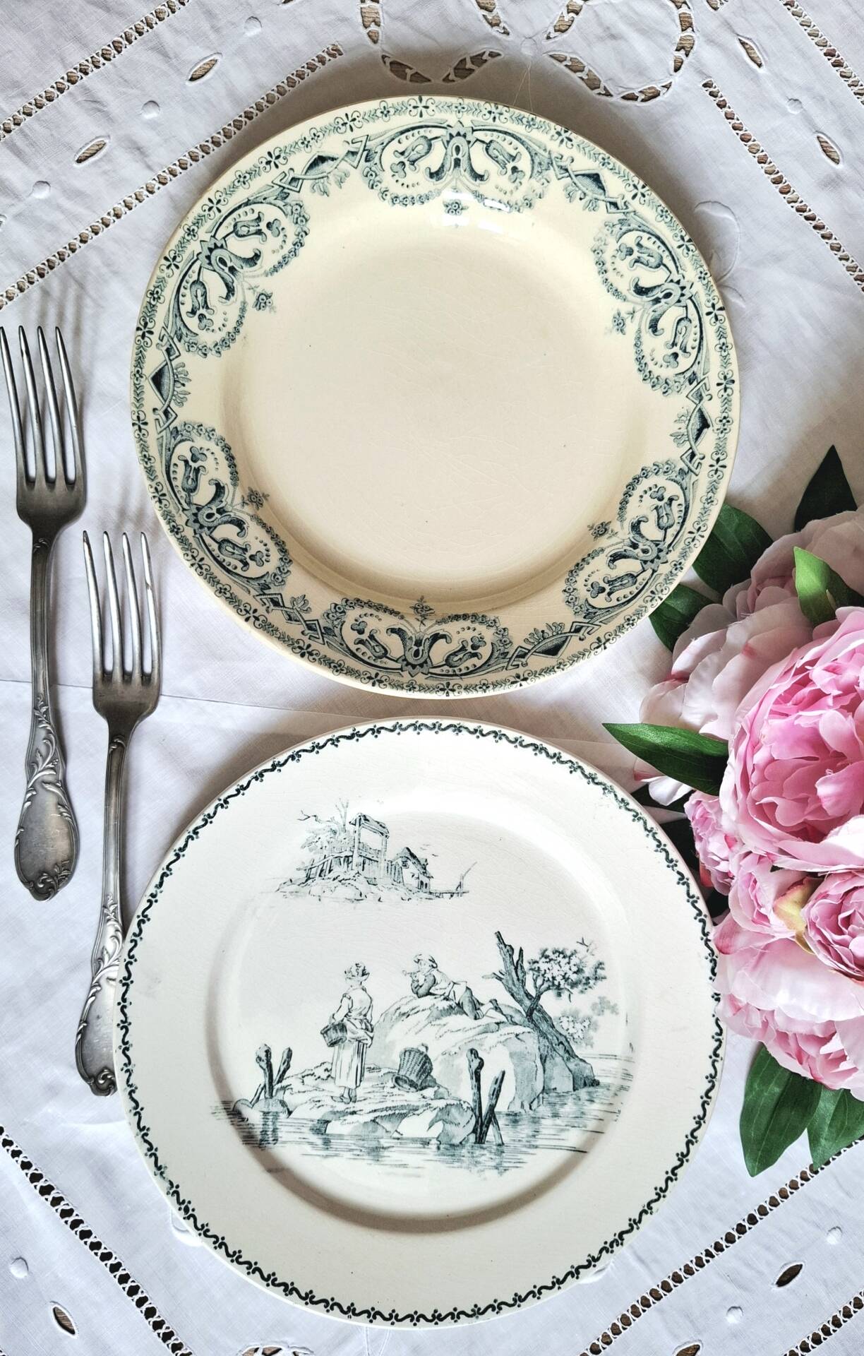 Old mismatched flat plates made of ironstone earthenware.