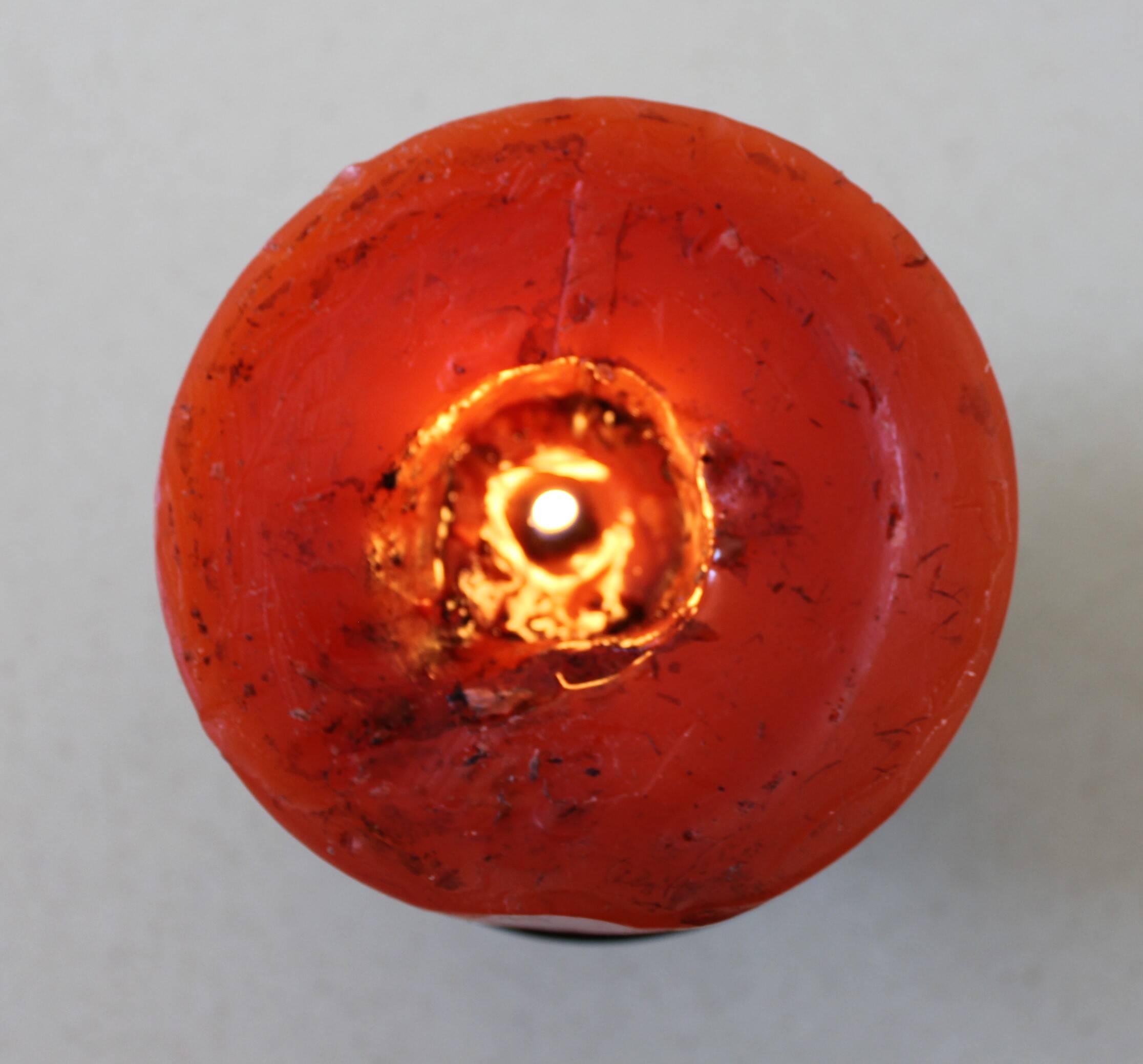 1970 wrought iron candlestick with its period coloured candle.