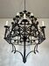 Lustre 12 lumières en fer forgé à décor de trèfles et feuillages
