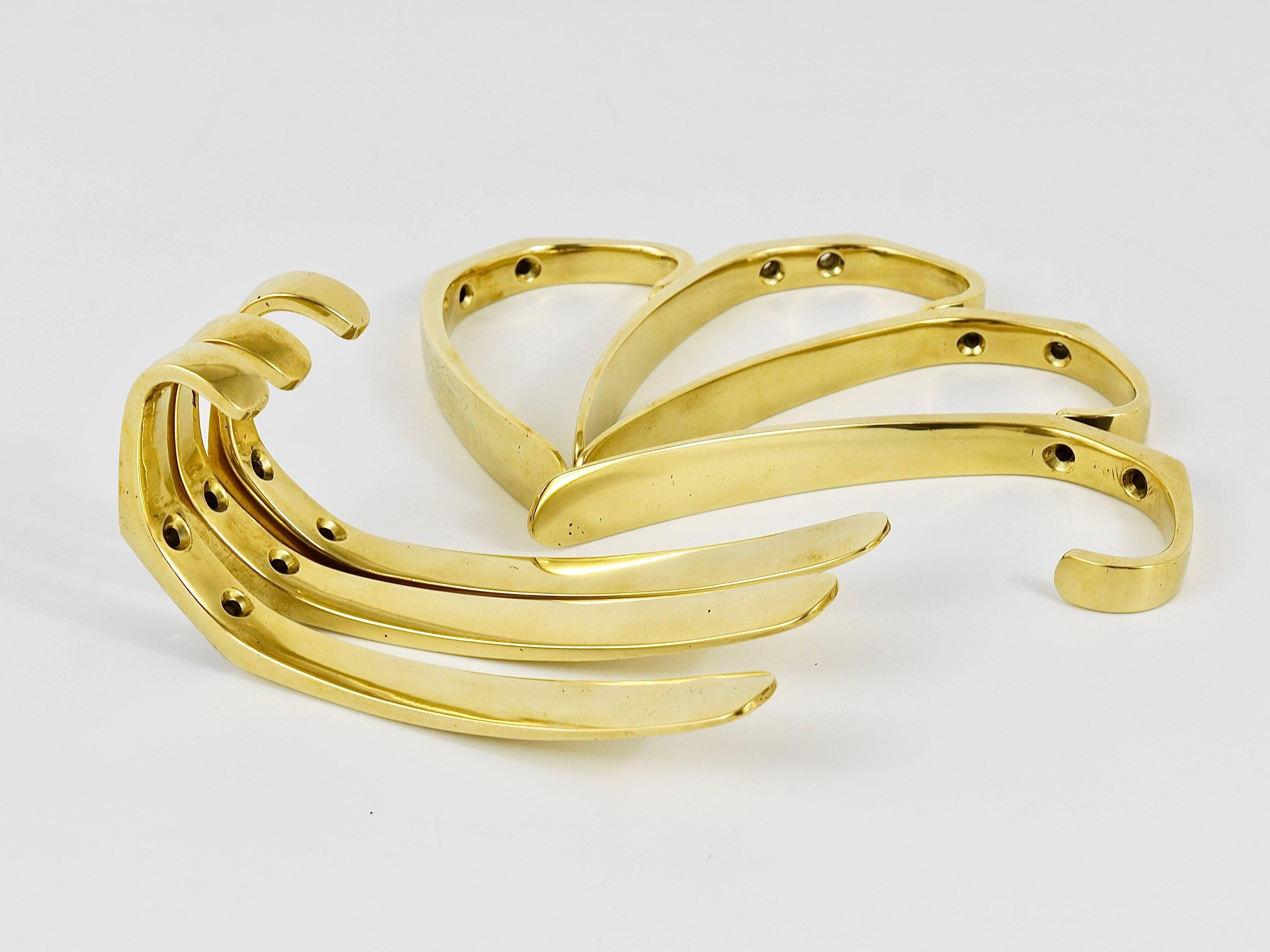 Up to four mid-century brass wall hooks by Herta Baller, Austria, 1950s.