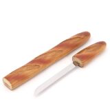 Bread knife in the shape of a wooden and stainless steel baguette