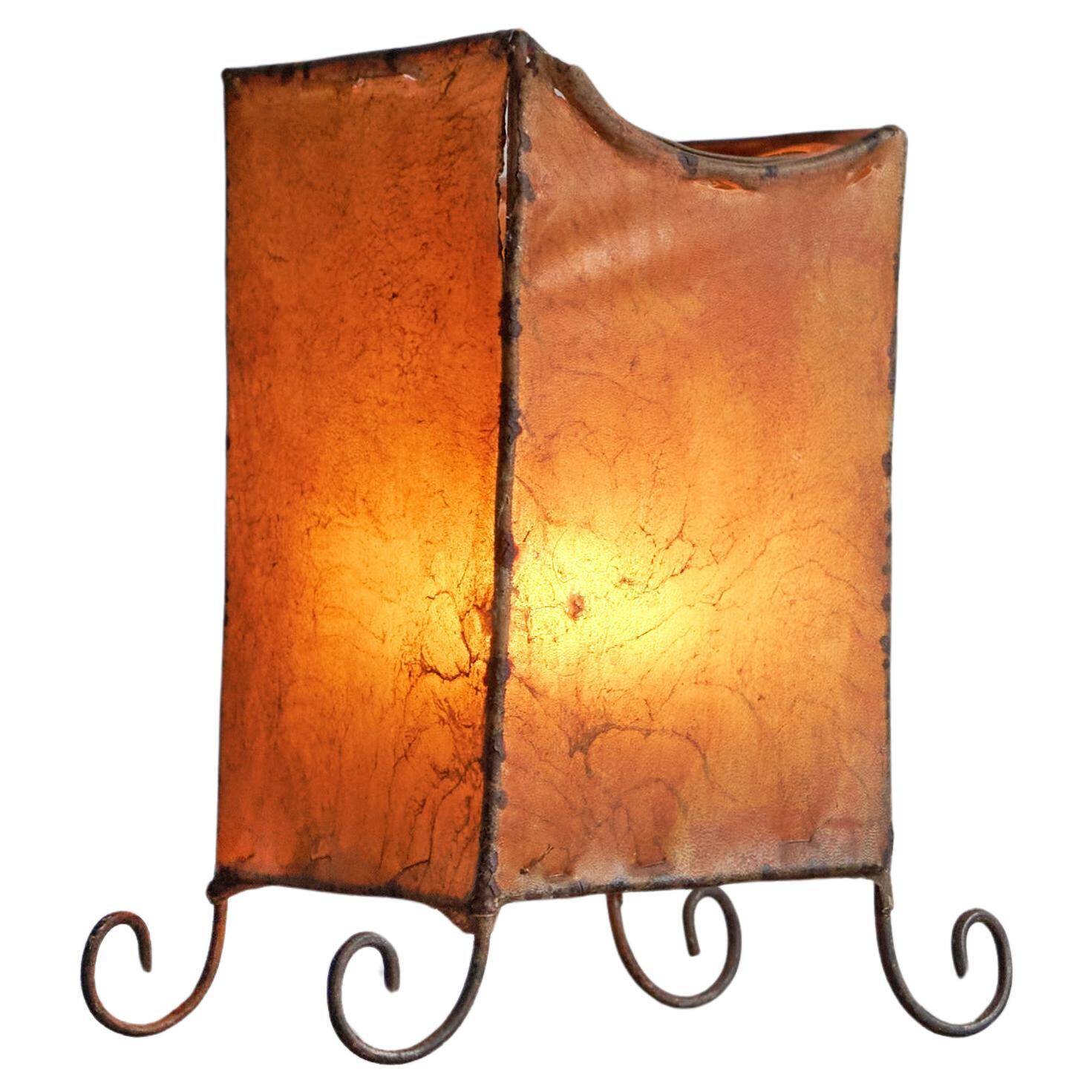 Mid-century table lamp in goat leather and wrought iron, 1950s