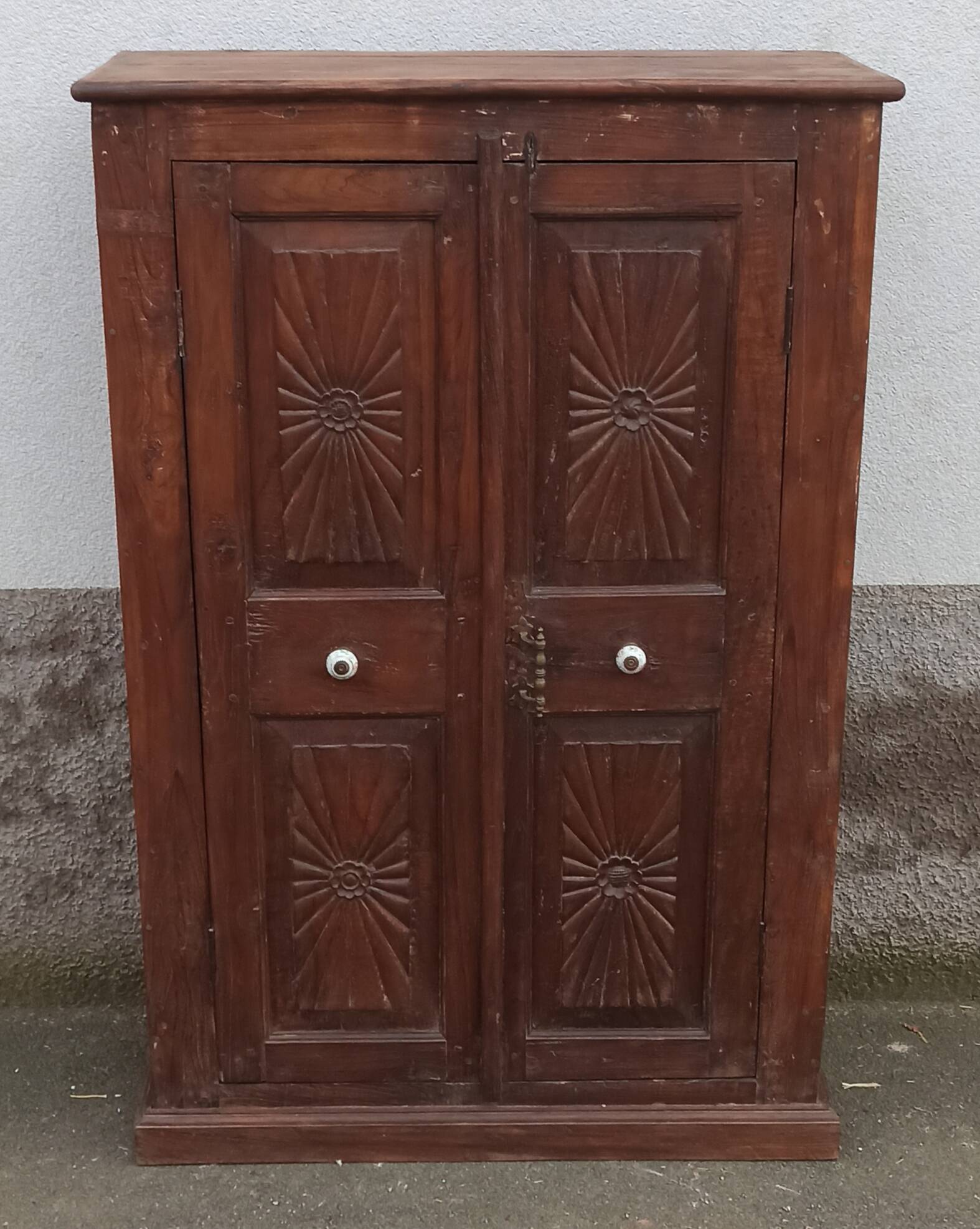 Old wooden cabinet with ceramic handles