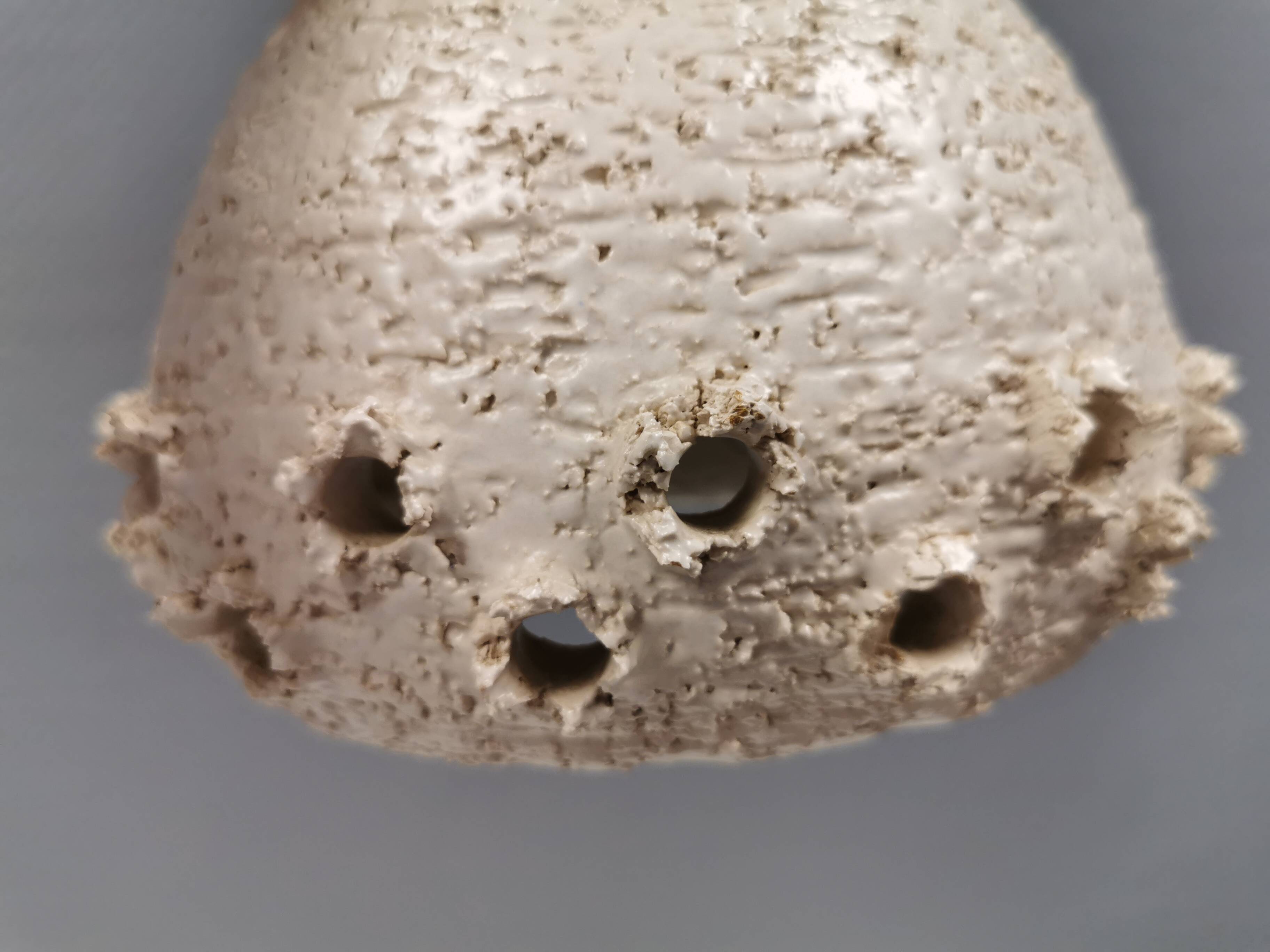 Two ceramic hanging lamps, in creamy white color, looking almost like coral