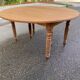 Round extendable banquet table stripped in solid mahogany with 4 extensions, 19th century.