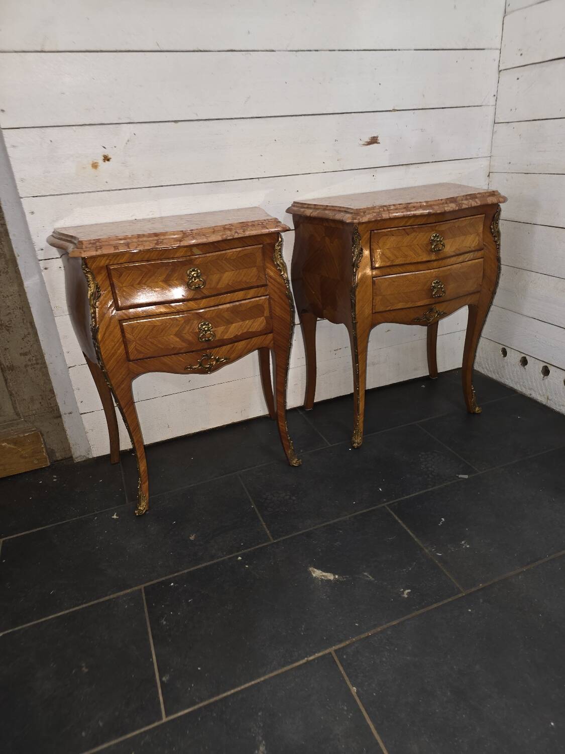 Pair of Louis XV style curved bedside tables in marquetry