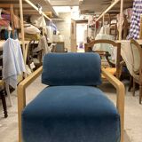 Contemporary armchair in blue velvet and oak