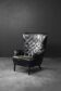 Vintage Danish modern wingback chair in black quilted leather, mid-20th century, 1960s.