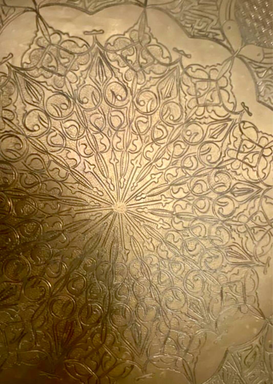 Old oriental tray in yellow copper