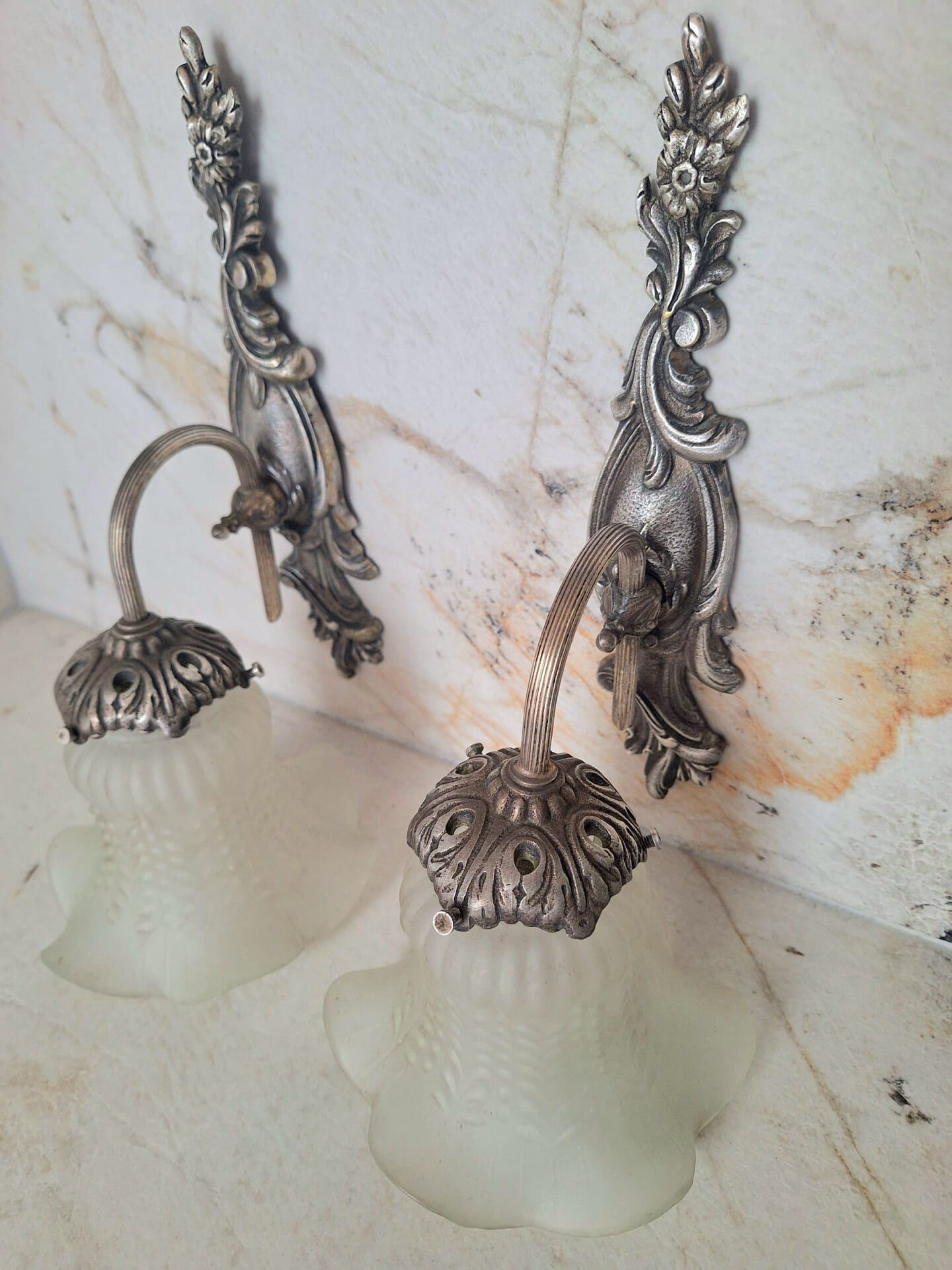 Pairs of Art Deco wall lights, antique fixtures.