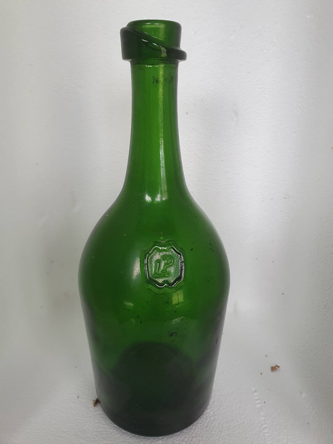 Old thick green glass bottle