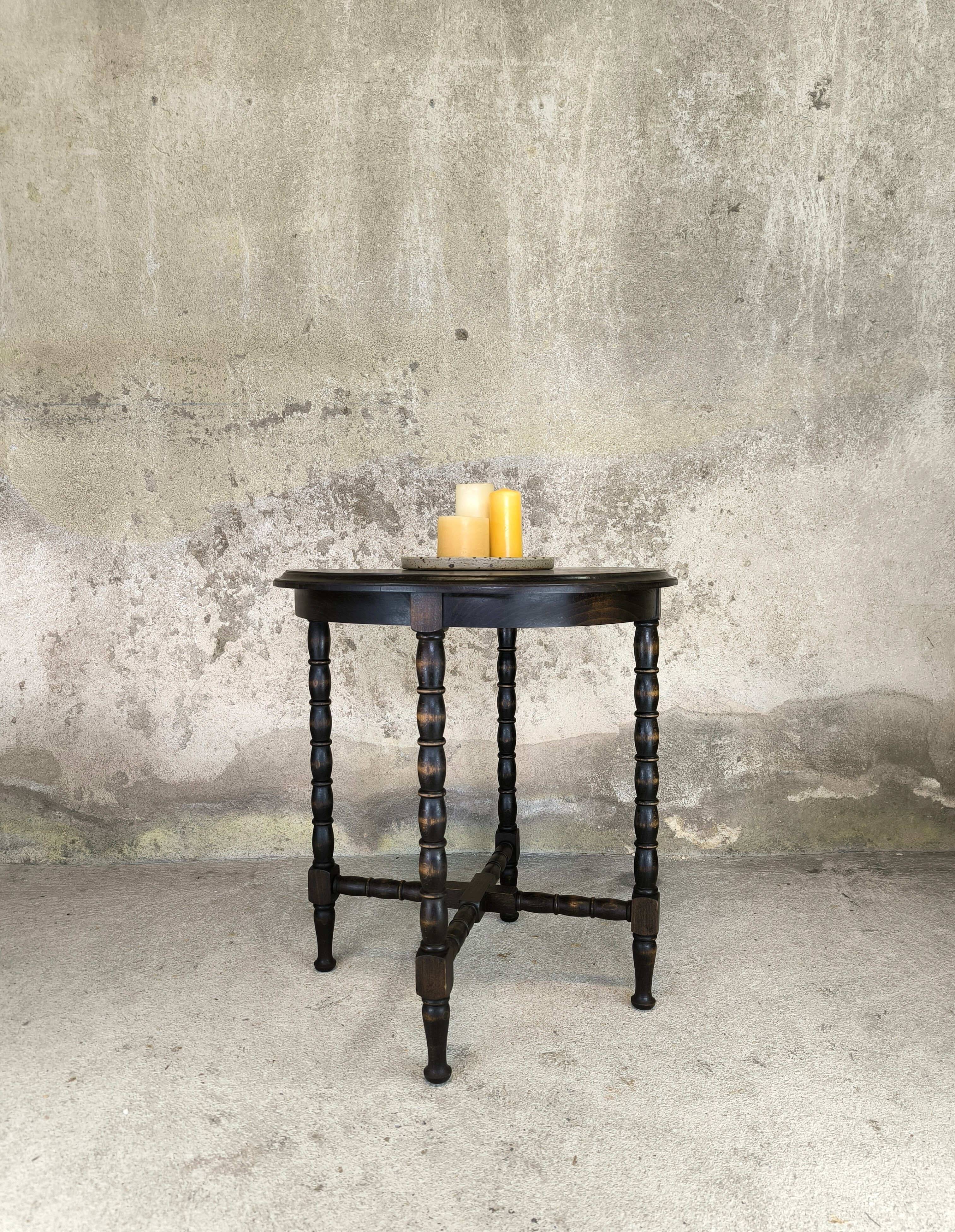 Vintage gueridon with beaded wooden legs.