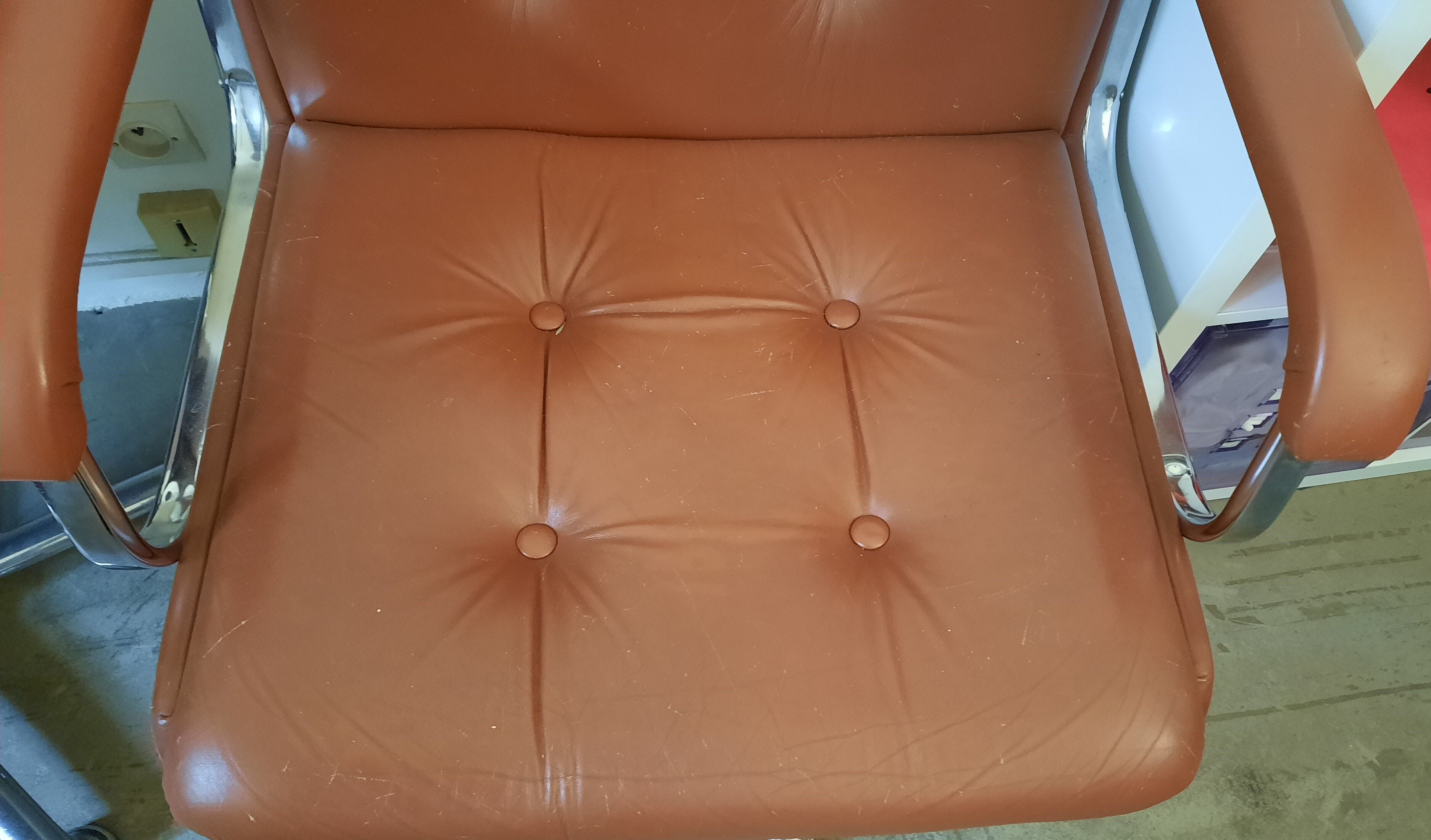Brown leather armchairs