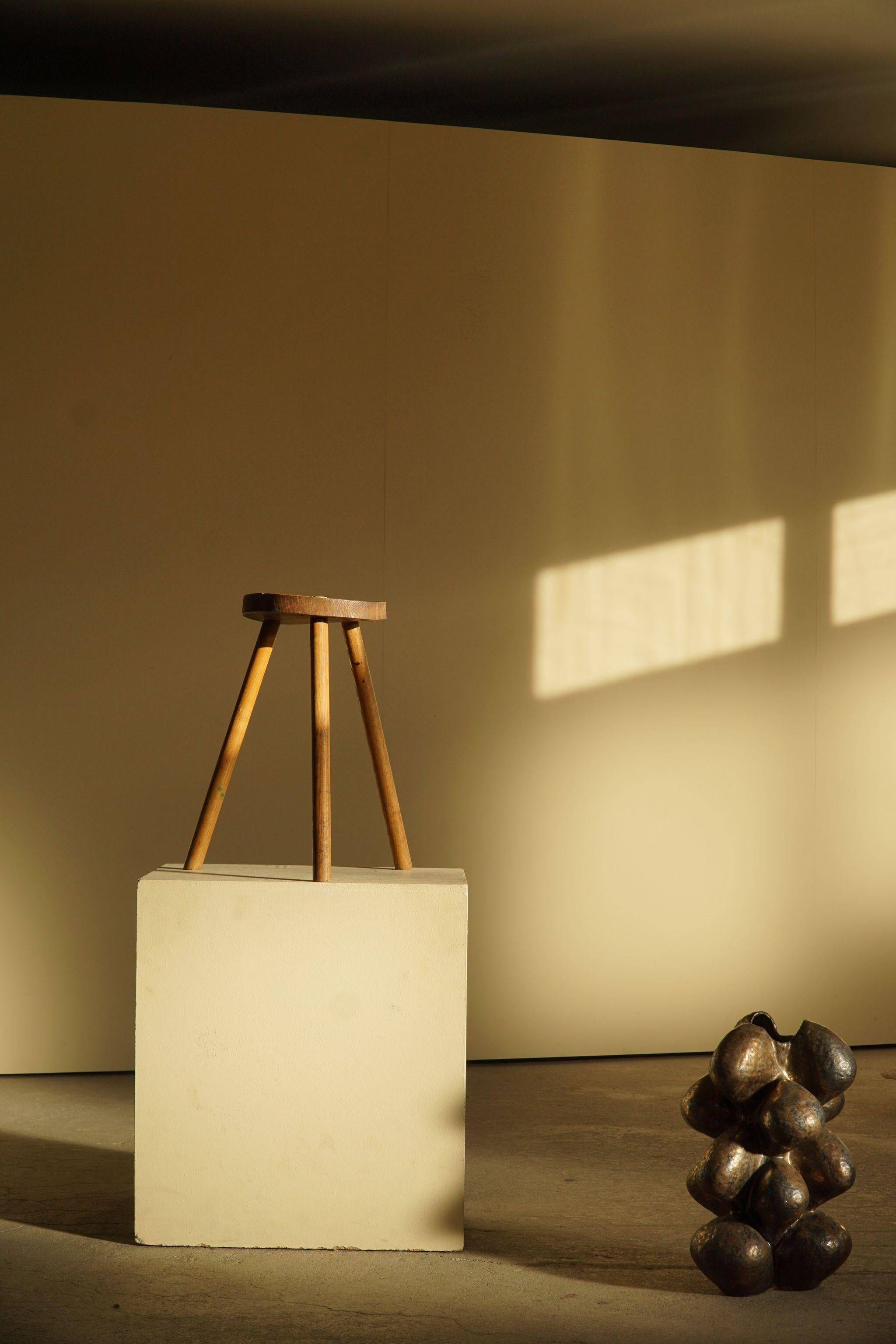 Tripod stool made of solid oak, by a Danish cabinetmaker, mid-century, around 1960.