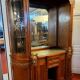 Empire style half-moon shaped mahogany bookcase with putti