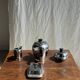 Tea set including teapot, milk jug, sugar bowl and butter dish