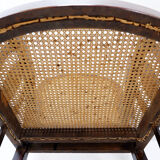 Art Deco armchairs in wood, with cane seat and backrest, circa 1930.