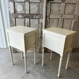 Pair of Louis XVI style bedside tables in white lacquered wood