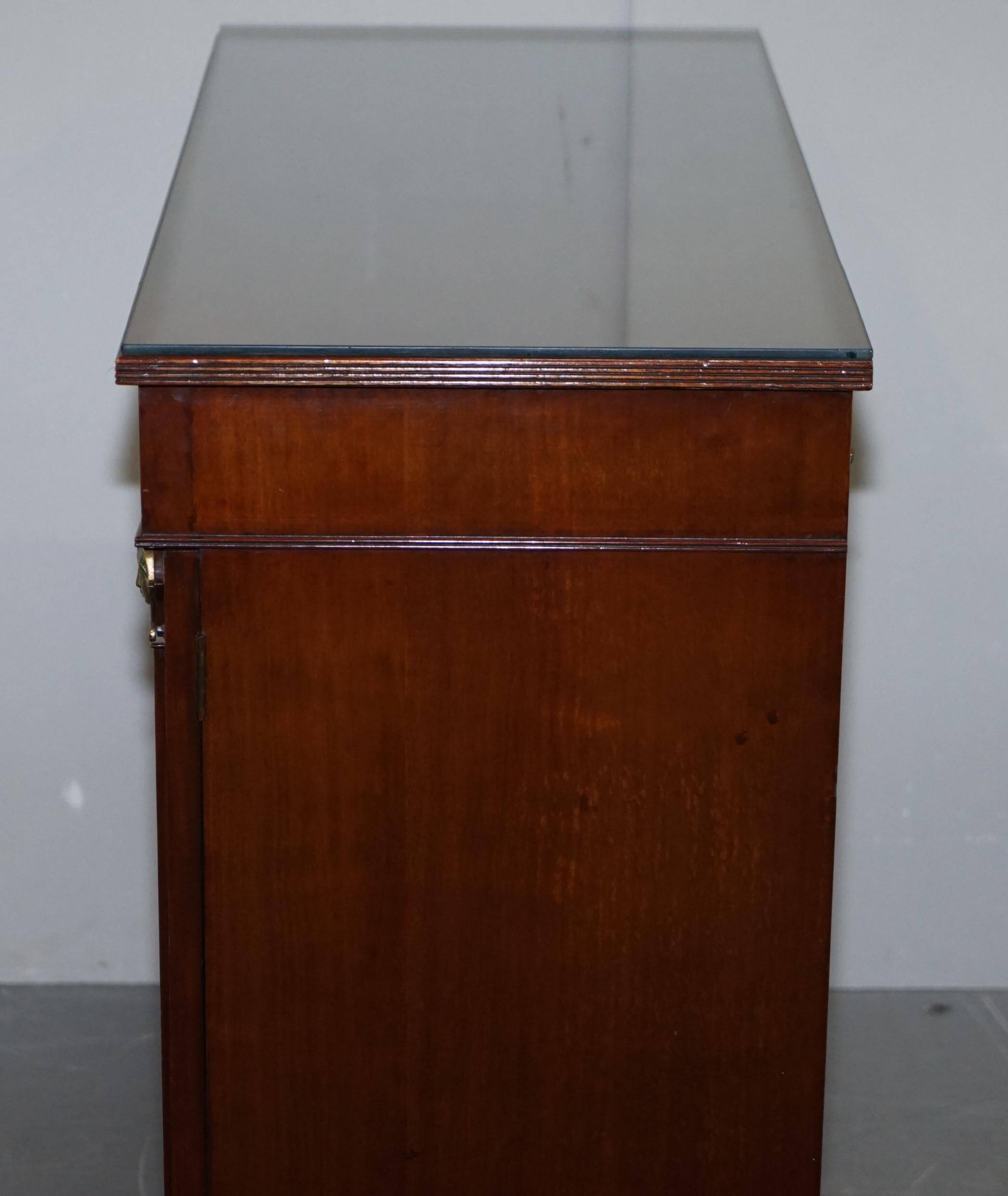 Antique buffet circa 1900 in hardwood and gilded bronze, Egyptian Revival style.
