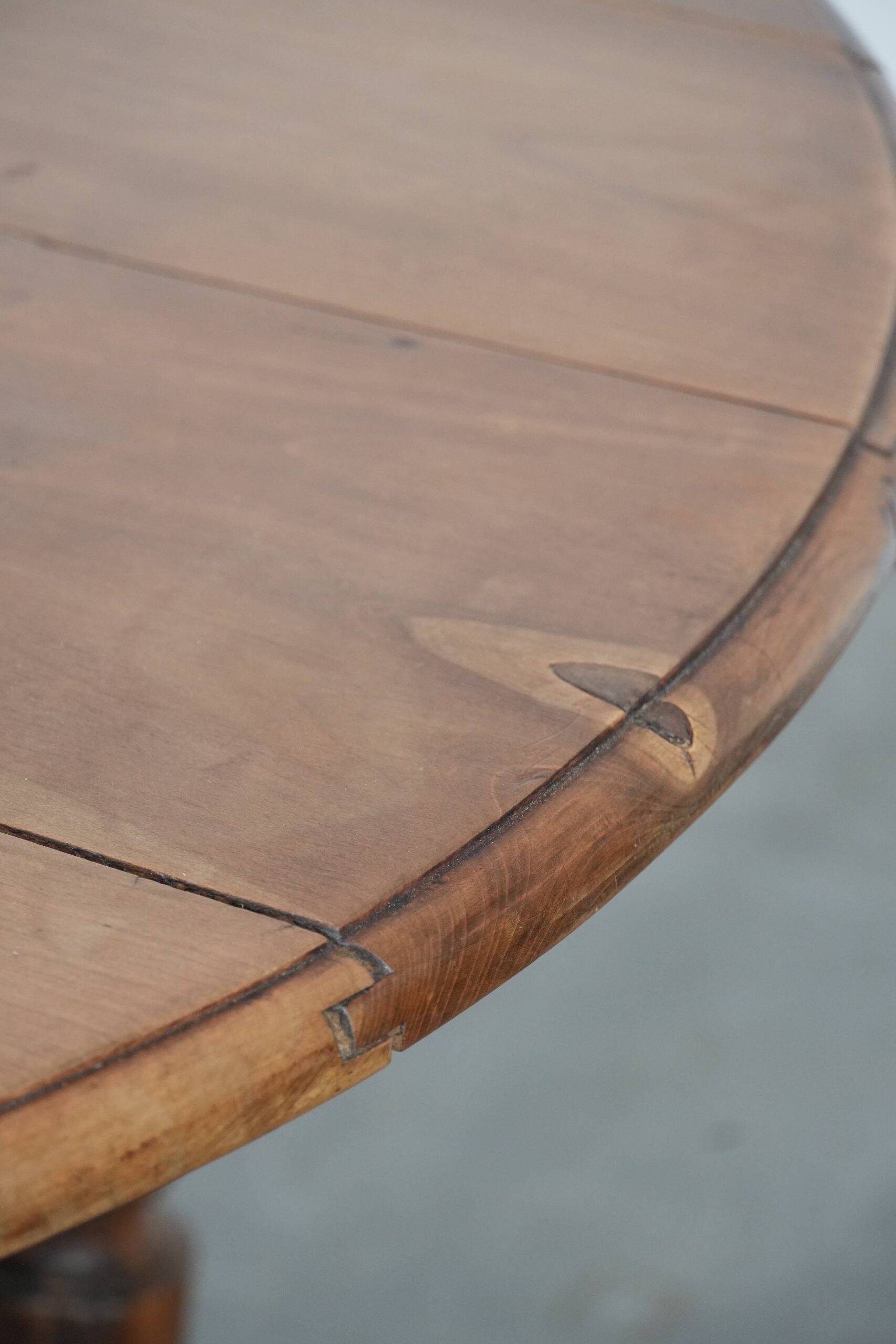 Antique English drop-leaf dining table made of walnut with elegant legs