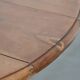 Antique English drop-leaf dining table made of walnut with elegant legs