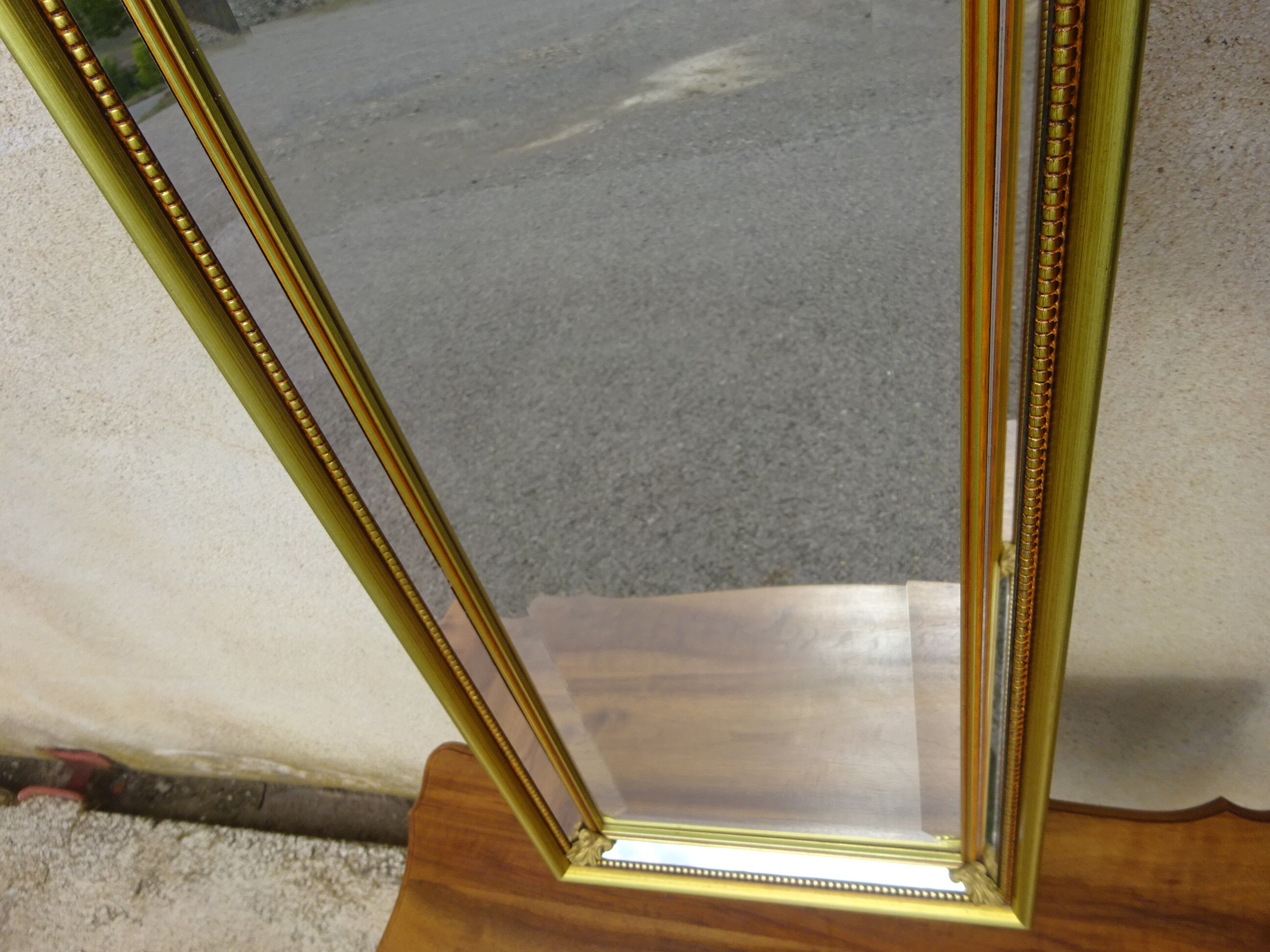 Vertical mirror, gold frame with beading.
